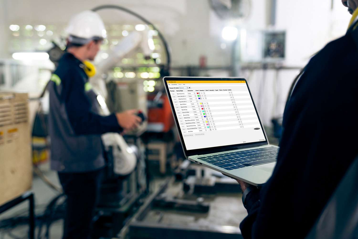 worker on laptop in factory